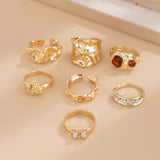 Gilded Drama: 7-Piece Statement Ring Set