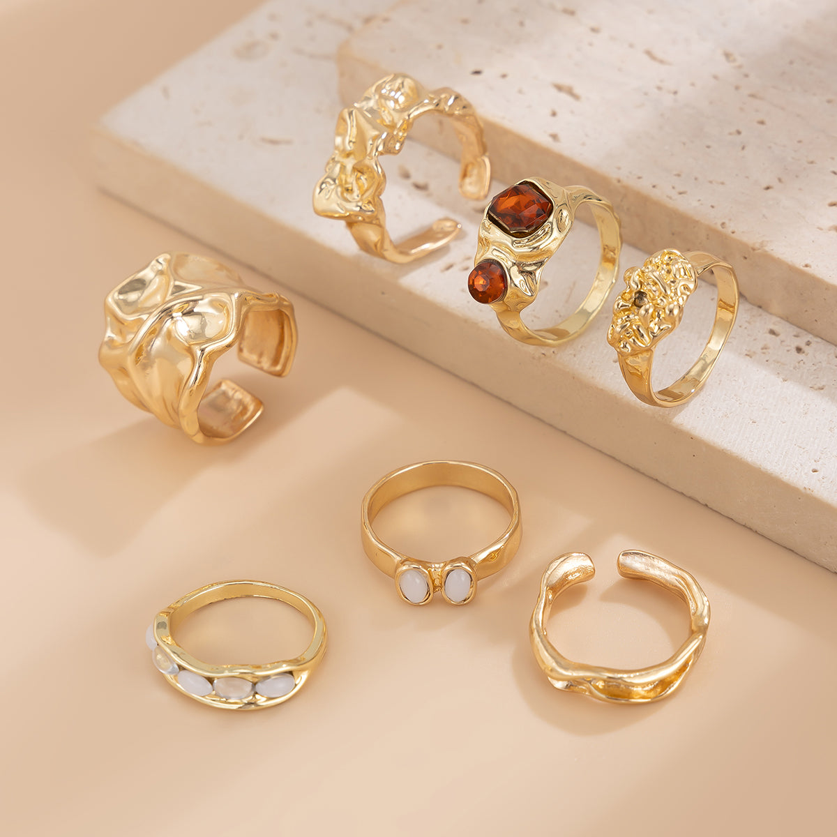 Gilded Drama: 7-Piece Statement Ring Set