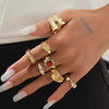 Gilded Drama: 7-Piece Statement Ring Set